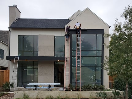 House painters working on tall ladder