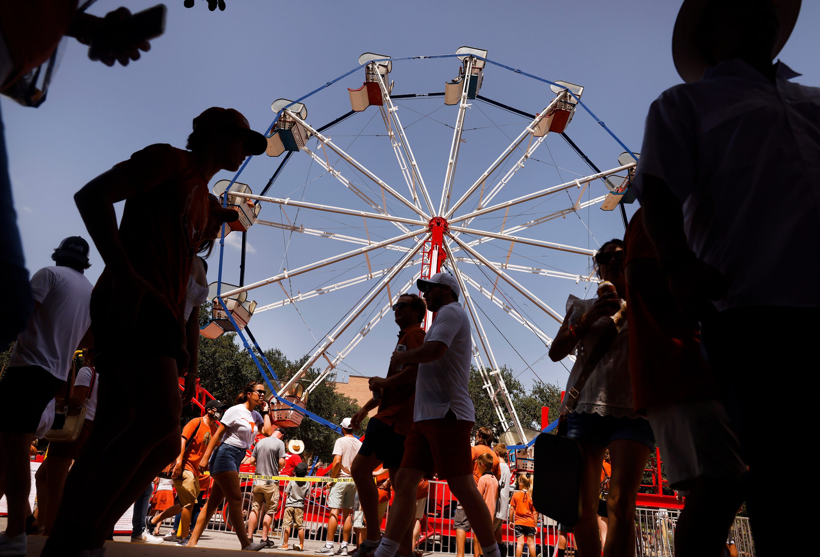 Fans ride a ferris wheel on Smokey's Midway, a mini 'state fair' outside of DKR-Texas...