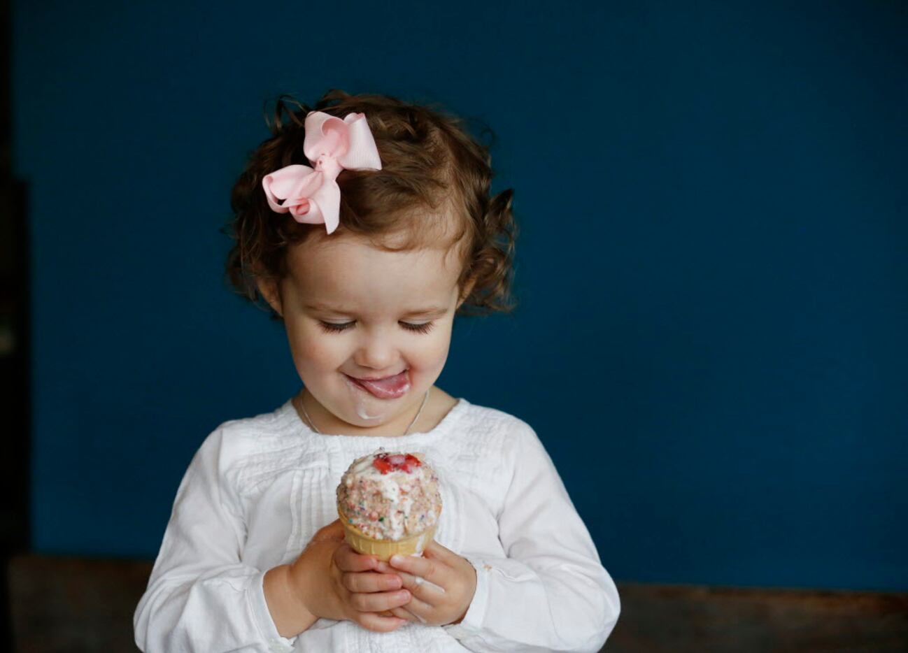 Blythe Durham, 1, of Dallas, eats ice cream while sitting for a portrait for The Dallas...
