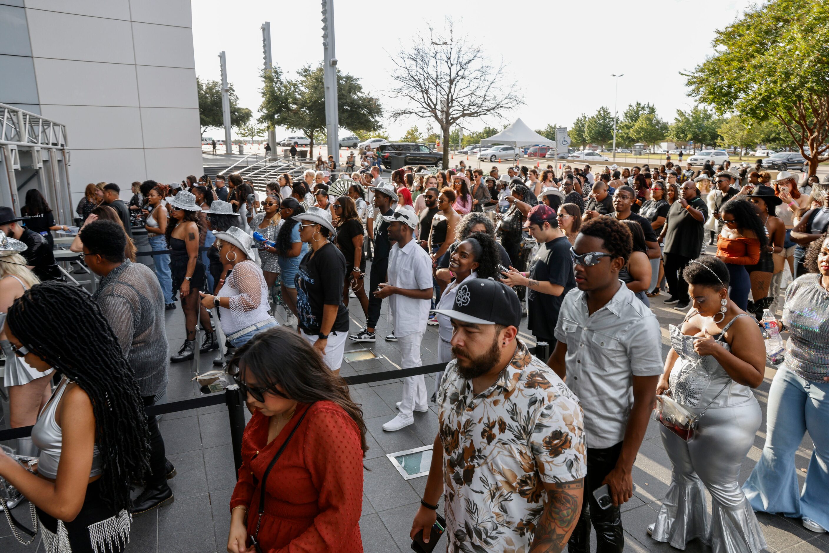 Attendees wait to enter AT&T Stadium for Beyoncé’s Renaissance World Tour concert ,...