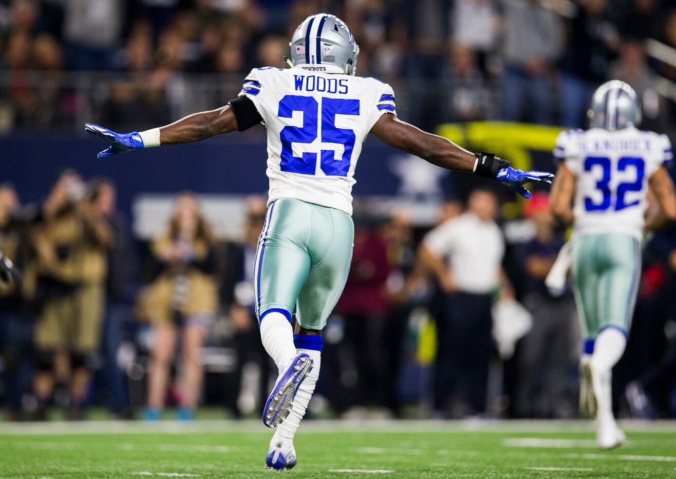 Dallas Cowboys safety Xavier Woods warms up before an NFL football