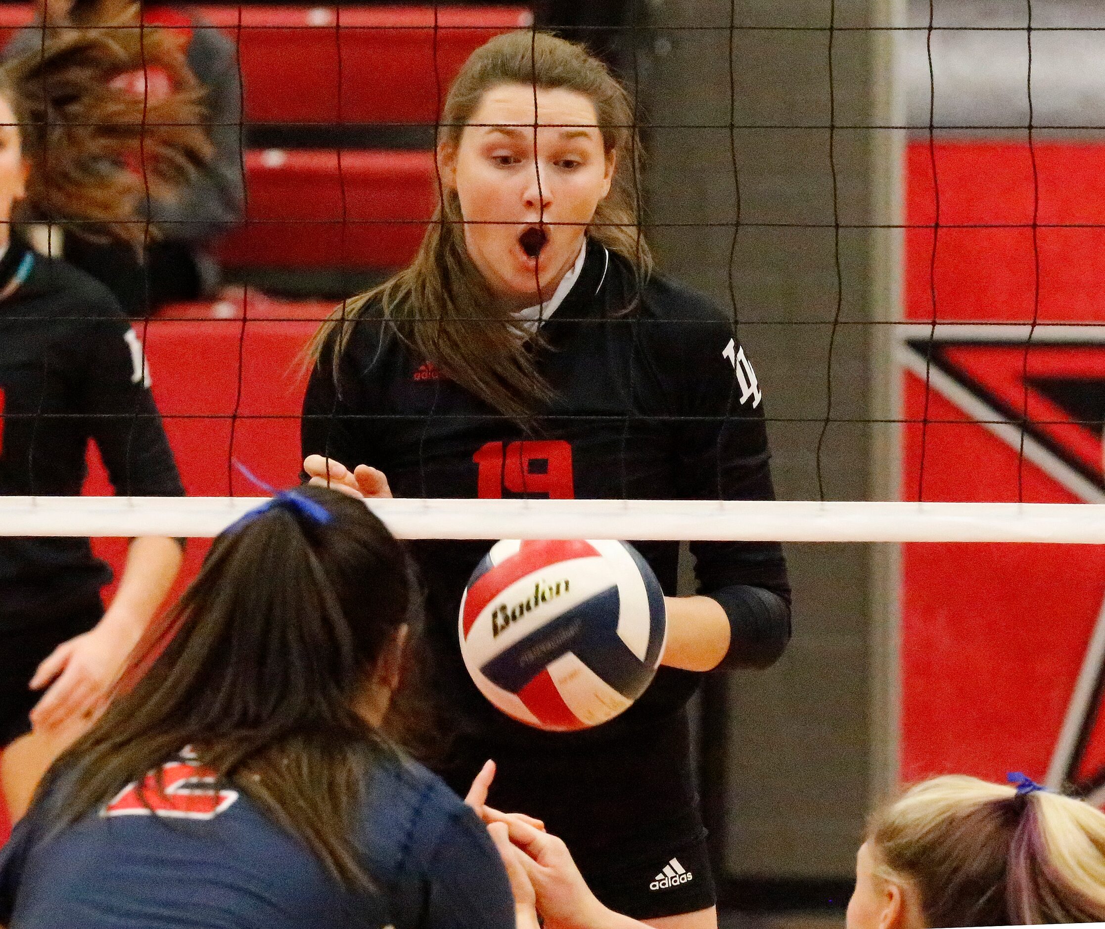 Lovejoy High School middle blocker Lexie Collins (19) shows surprise as Grapevine High...