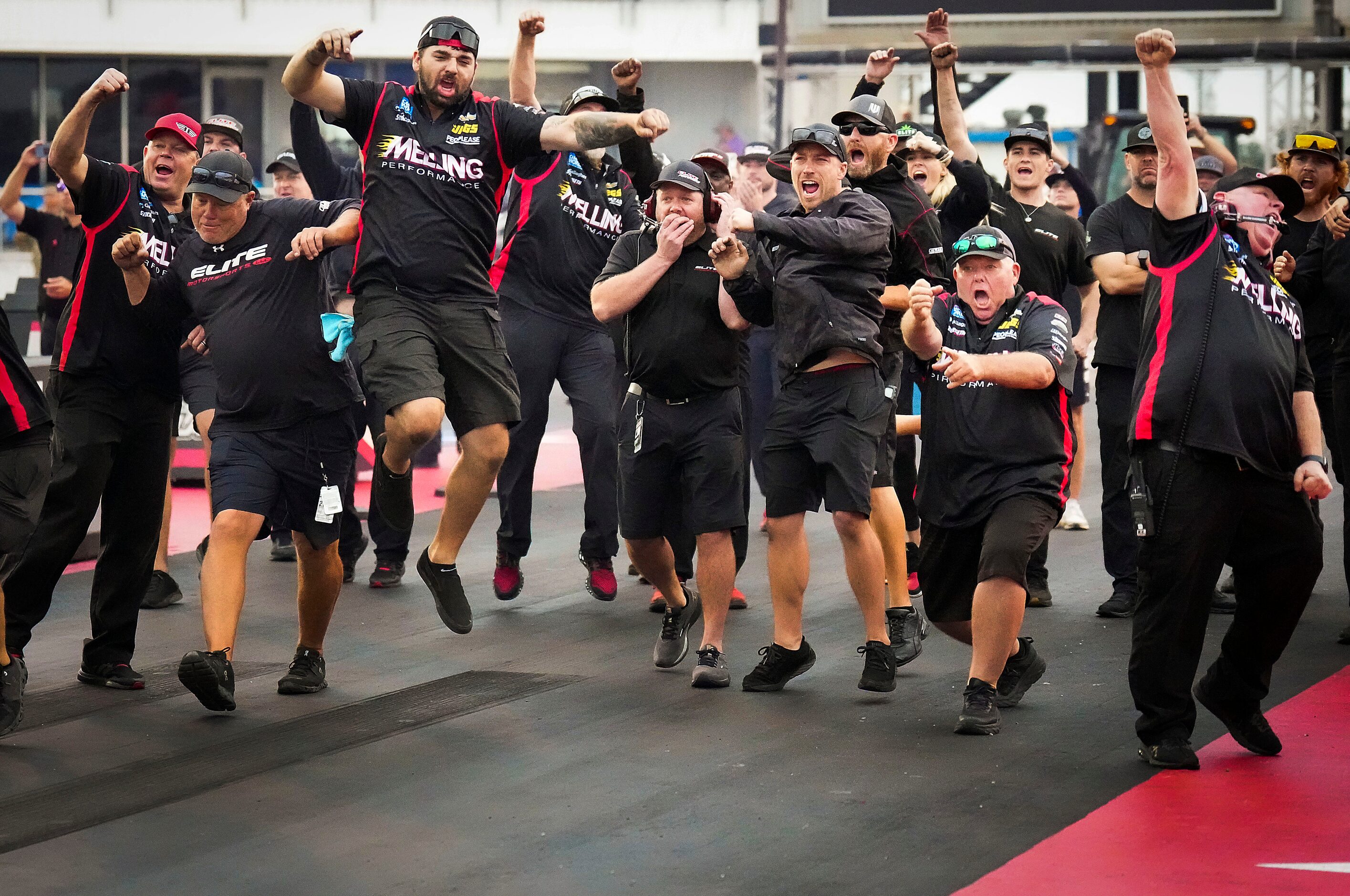 Erica Enders	crew celebrates as she crosses the line in her Pro Stock victory over Greg...