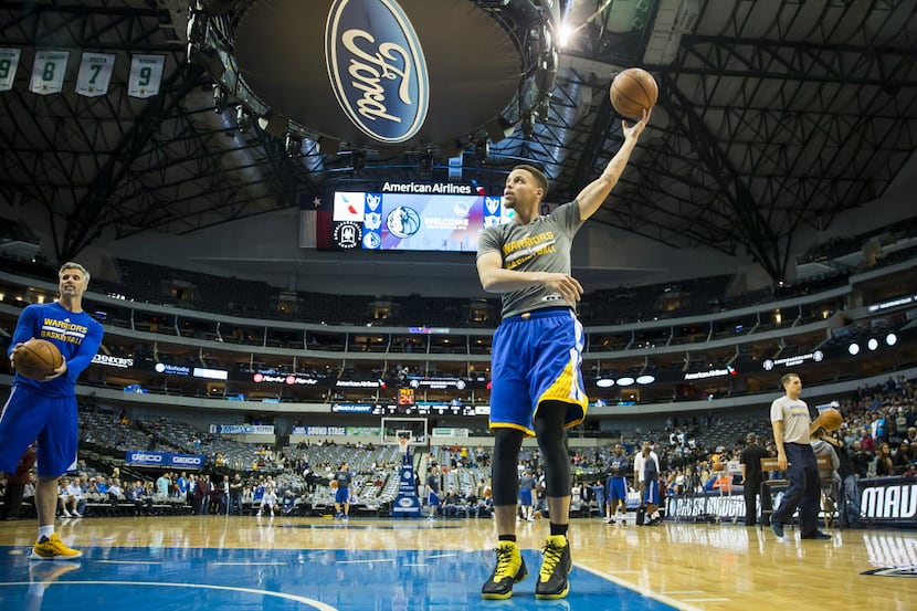Golden State Warriors guard Stephen Curry warms up before an NBA basketball game against the...