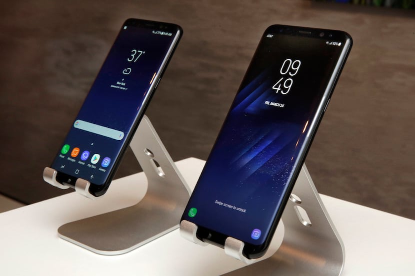 In this Friday, March 24, 2017, photo, new Samsung Galaxy S8, left, and Galaxy S8 Plus...