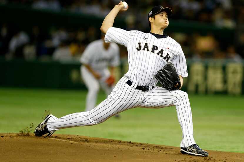 FILE - Japan starter Shohei Otani pitches against South Korea during the first inning of a...