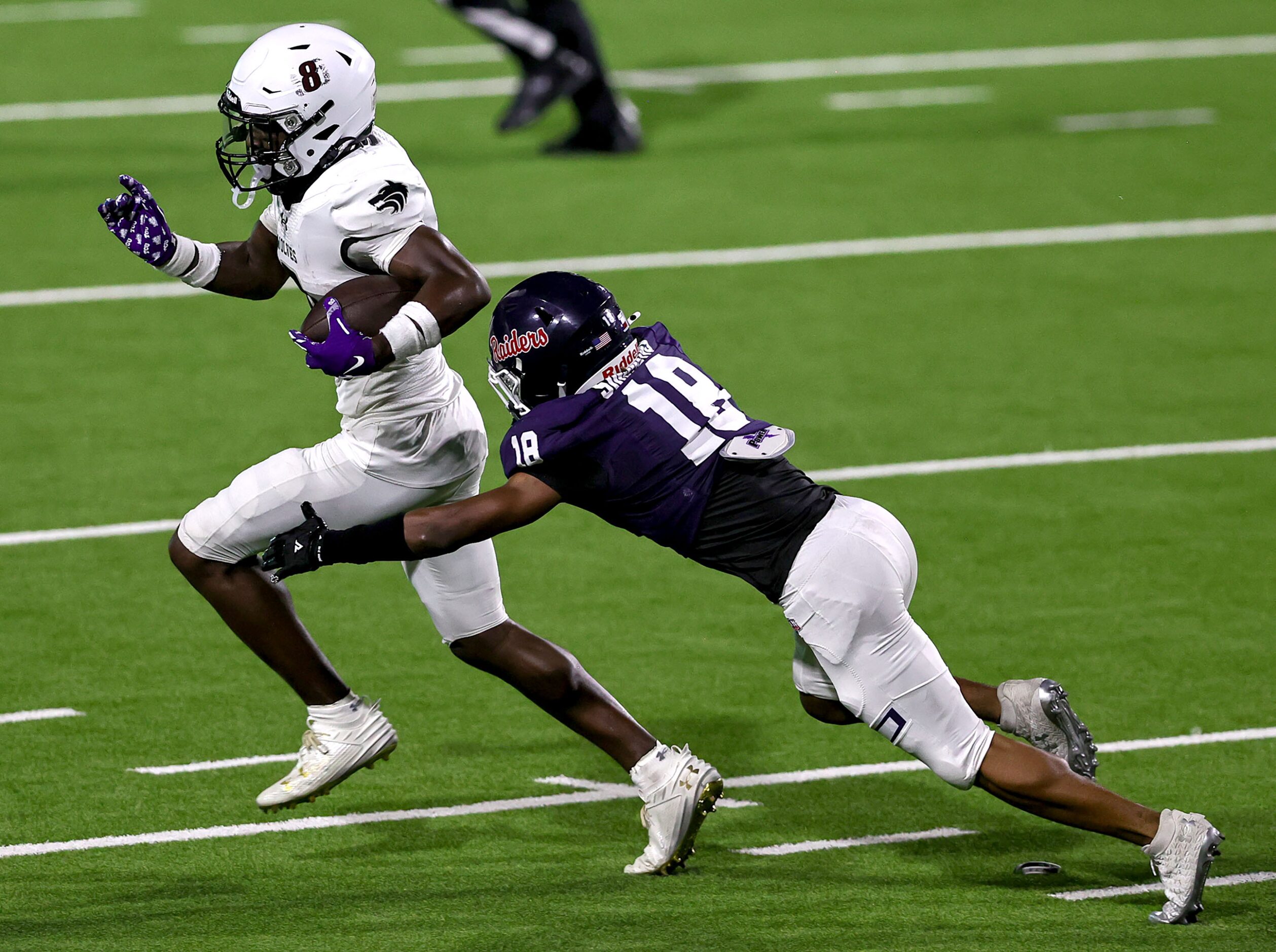 Mansfield Timberview wide receiver Chance Collins (8) makes a reception and tries to avoid...