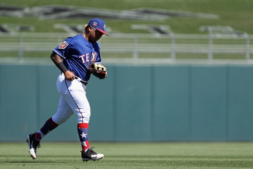 SURPRISE, AZ - MARCH 05:  Outfielder Willie Calhoun #5 of the Texas Rangers runs off the...