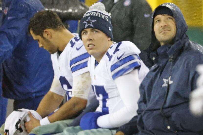 Dallas Cowboys quarterbacks Matt Cassel (16), Kellen Moore (17) and Tony Romo sit together...