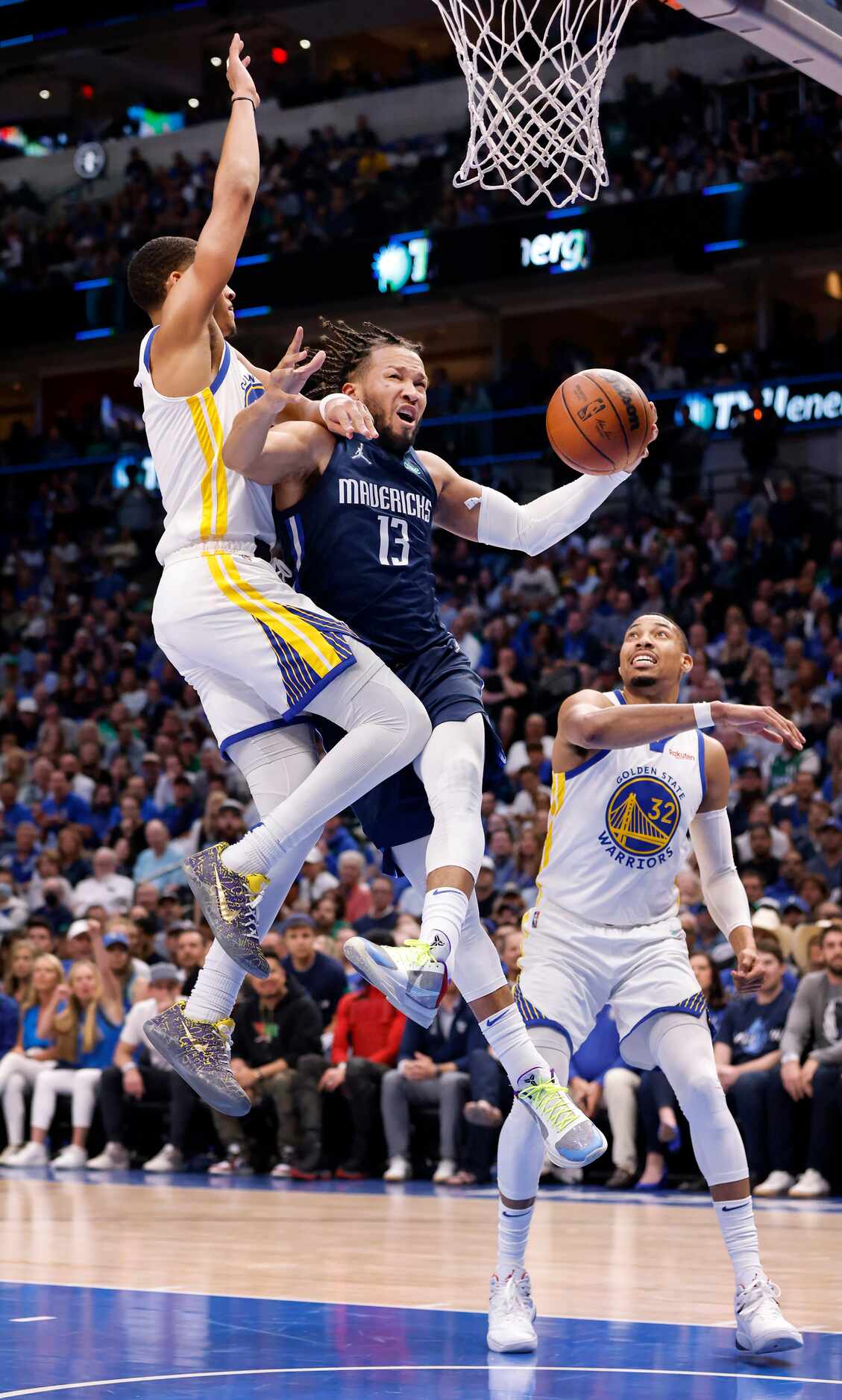 Dallas Mavericks guard Jalen Brunson (13) drives  for a layup against Golden State Warriors...