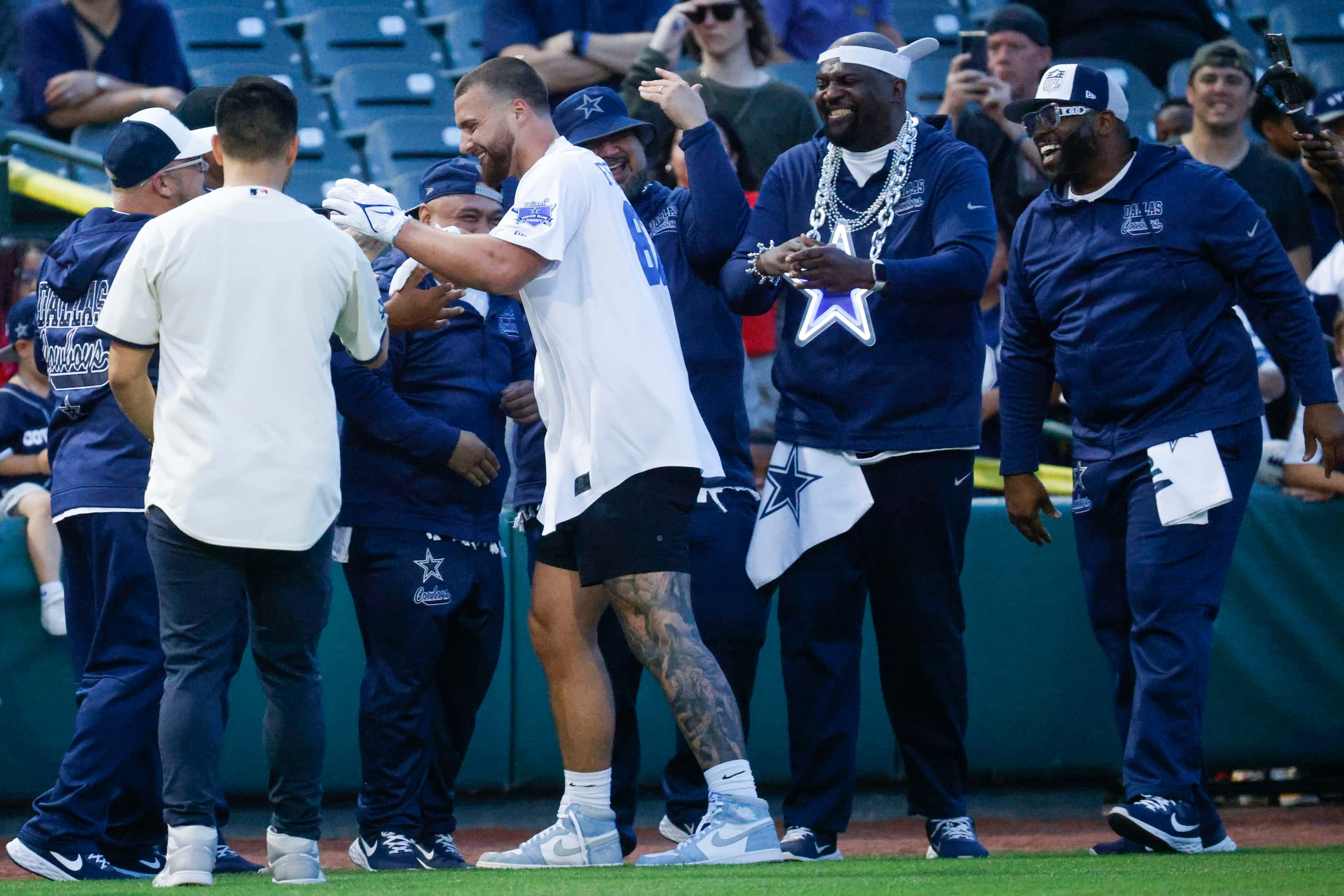 Dallas Cowboys’ Jake Ferguson is greeted by the ManiAACs after a  homerun during annual home...