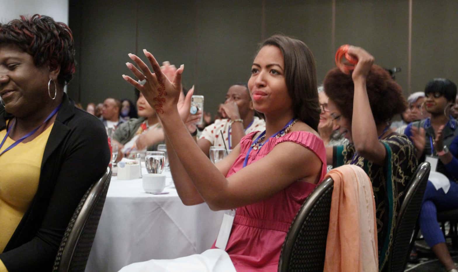 Jade Lenore applauds keynote speaker Jonathan Thunderword at the Black Trans Advocacy...