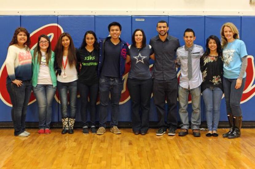 
South Garland High School seniors posed with principal Tracy Curtis (center) and Class of...