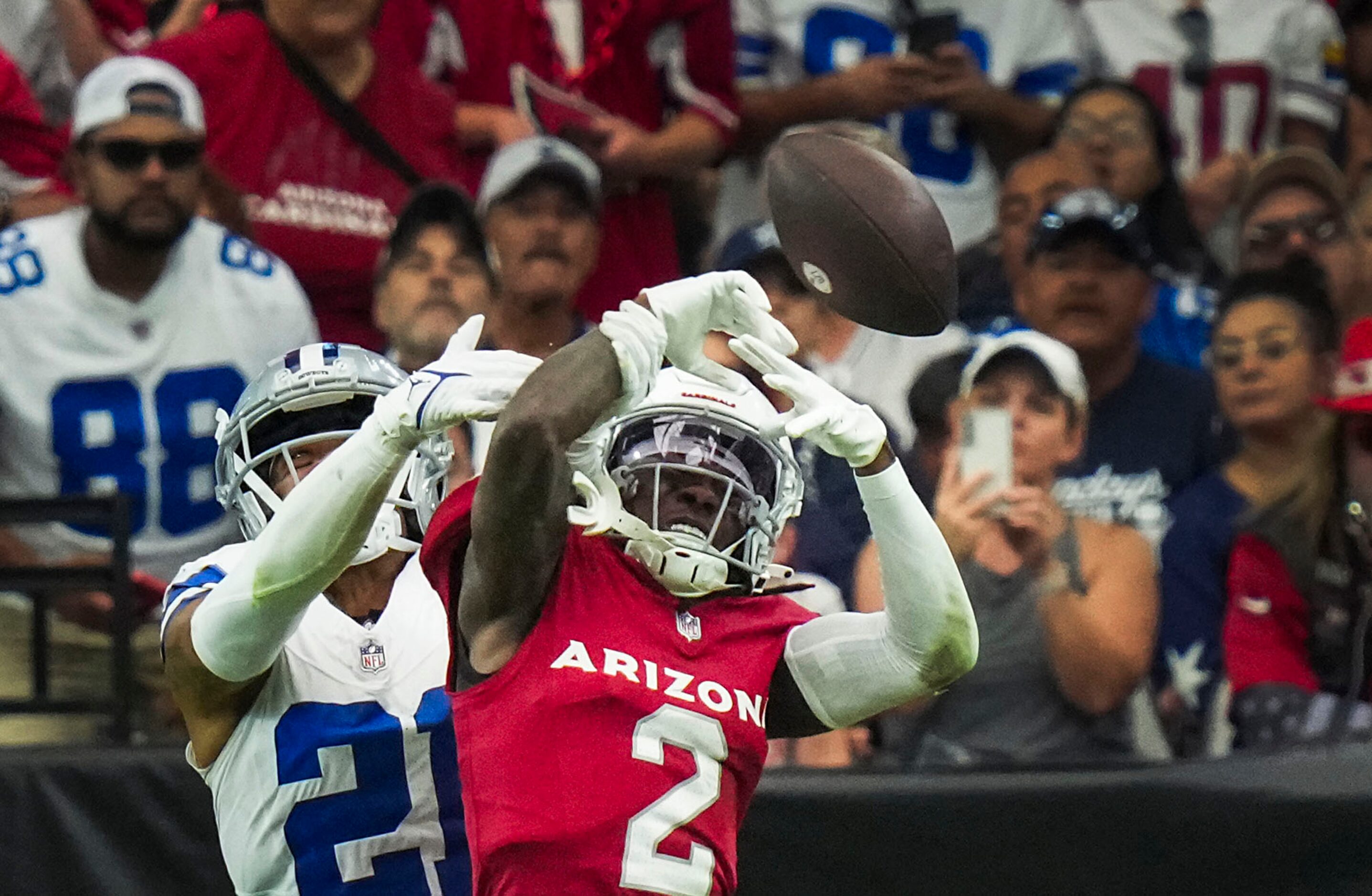 Dallas Cowboys cornerback Stephon Gilmore (21) breaks up a pass intended for Arizona...