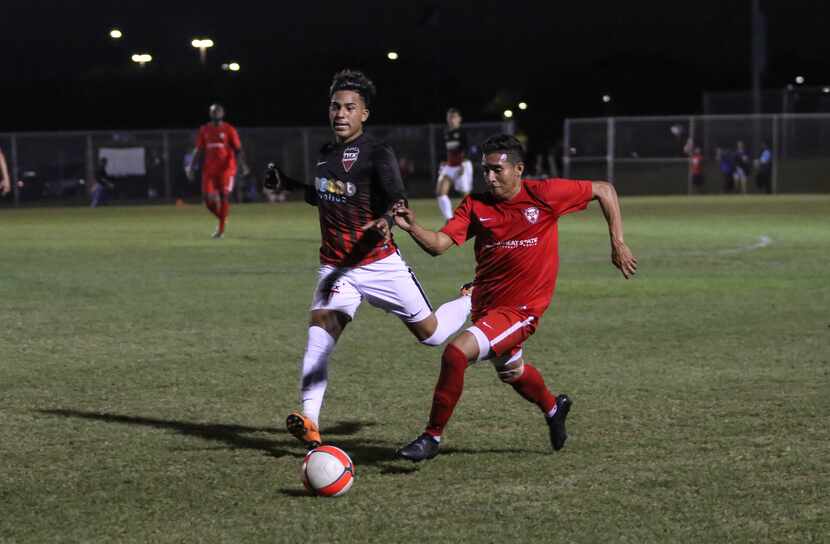 Lucio Martinez of NTX Rayados tries to slow down Nelson Landaverde of FC Wichita in their...