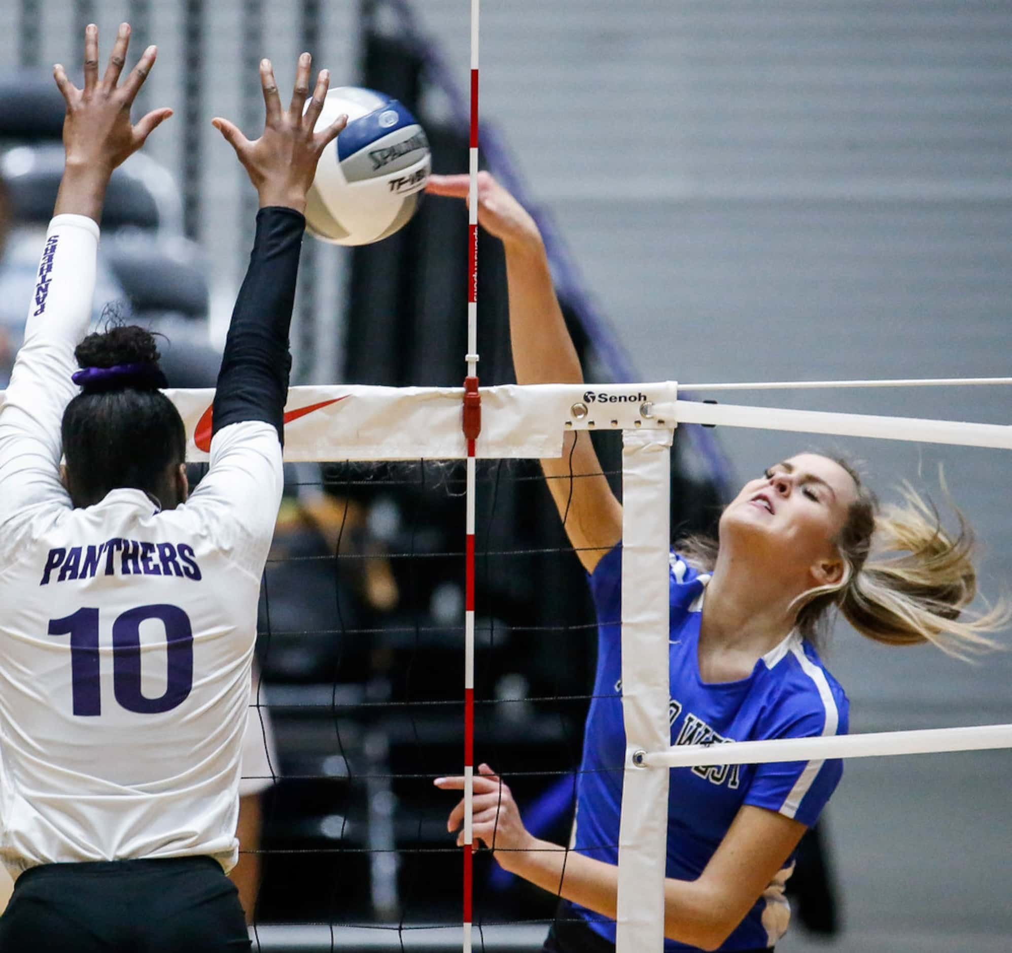 Plano WestÃs Noelle Piatas (6) tips the ball over the net during the first match of a Class...