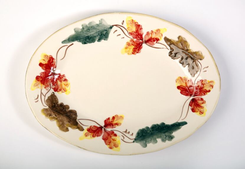 Autumn leaves: Serve dinner guests from a hand-painted platter, $49.95, and bowl, $39.95,...
