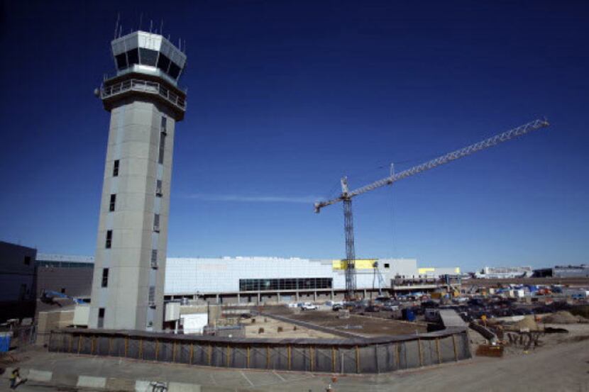 The new 20-gate terminal is under construction adjacent to the control tower at Love Field....