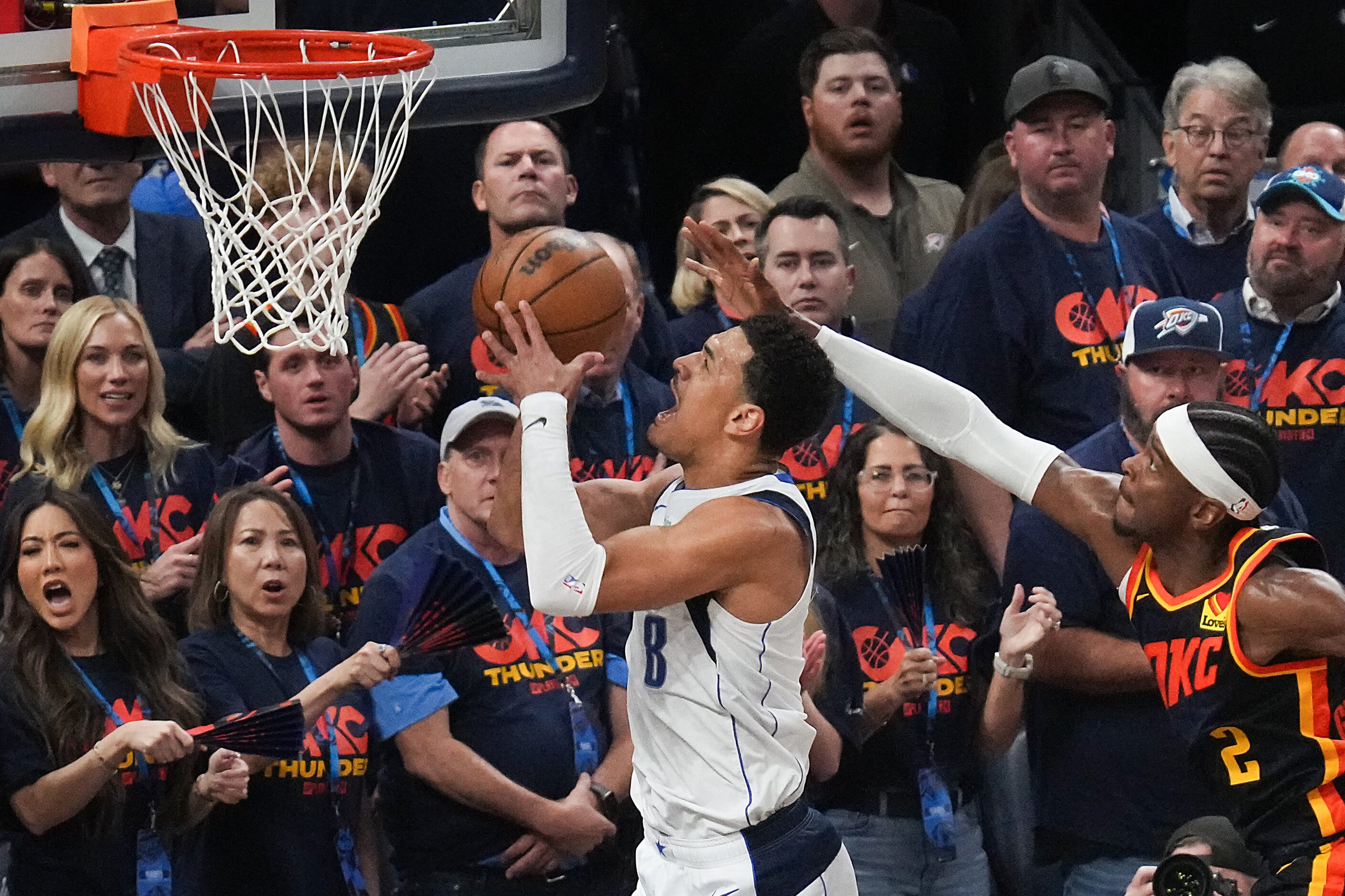 Dallas Mavericks guard Josh Green (8) drives to the basket past Oklahoma City Thunder guard...