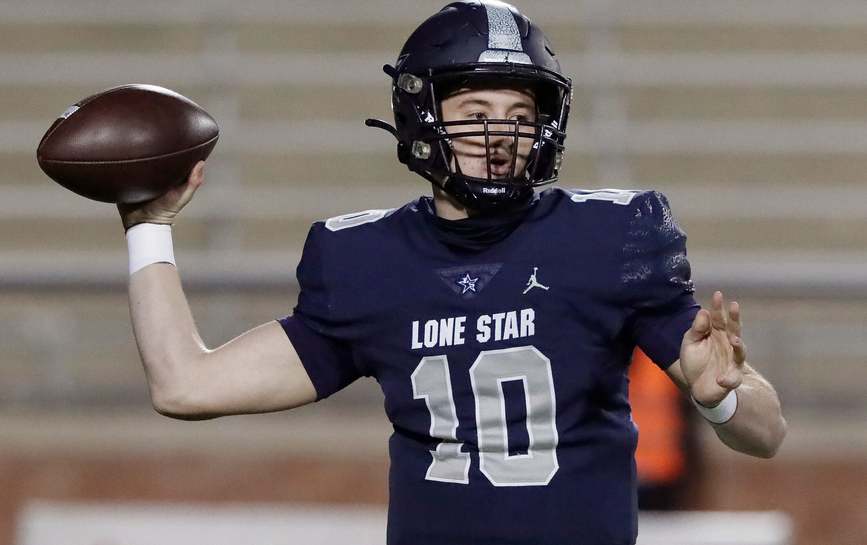 Lone Star High School quarterback Collin Blackstock (10) throws a pass during the first half...