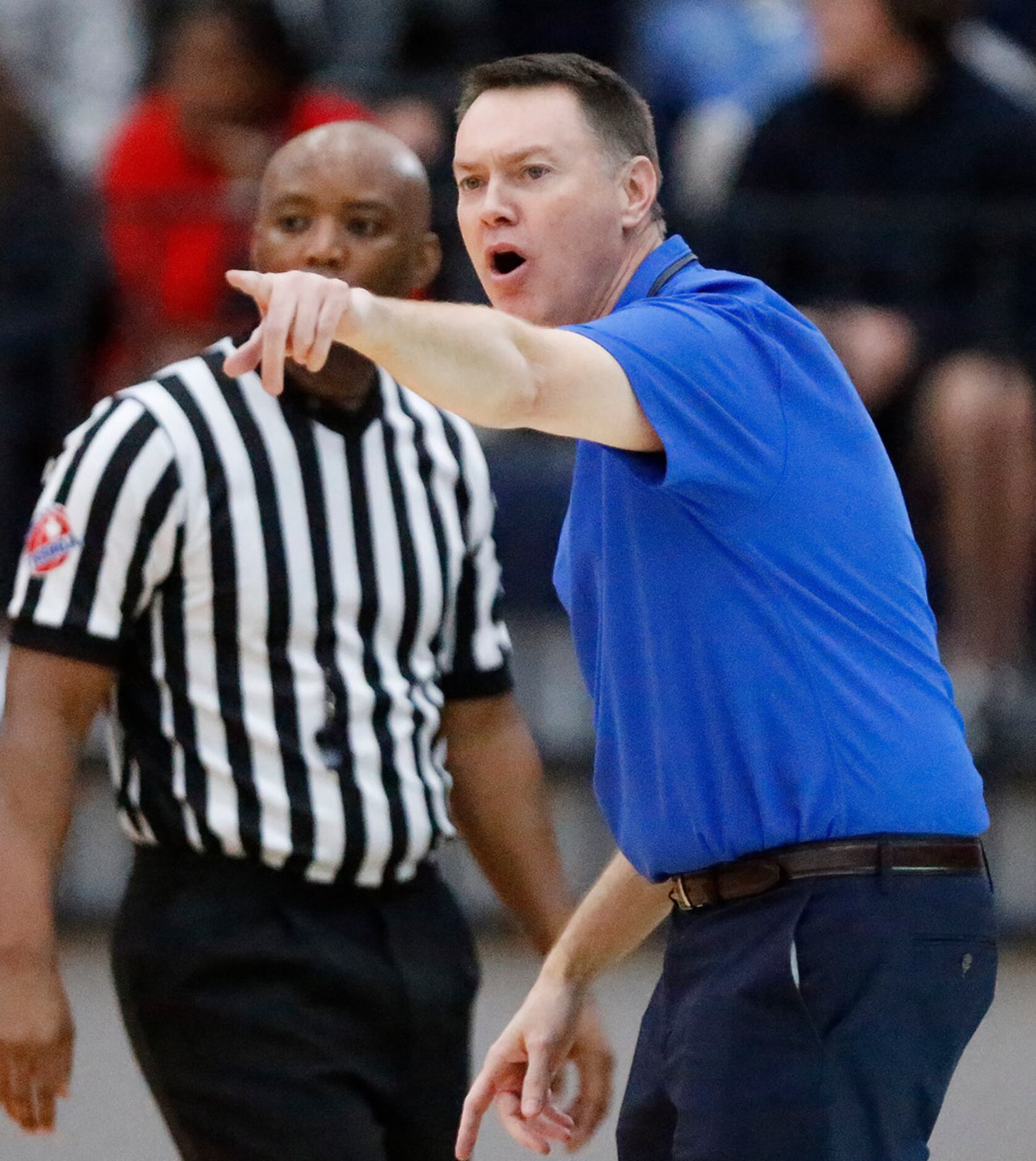 Allen High School head coach Joe McCullough makes a point to the referee during the first...