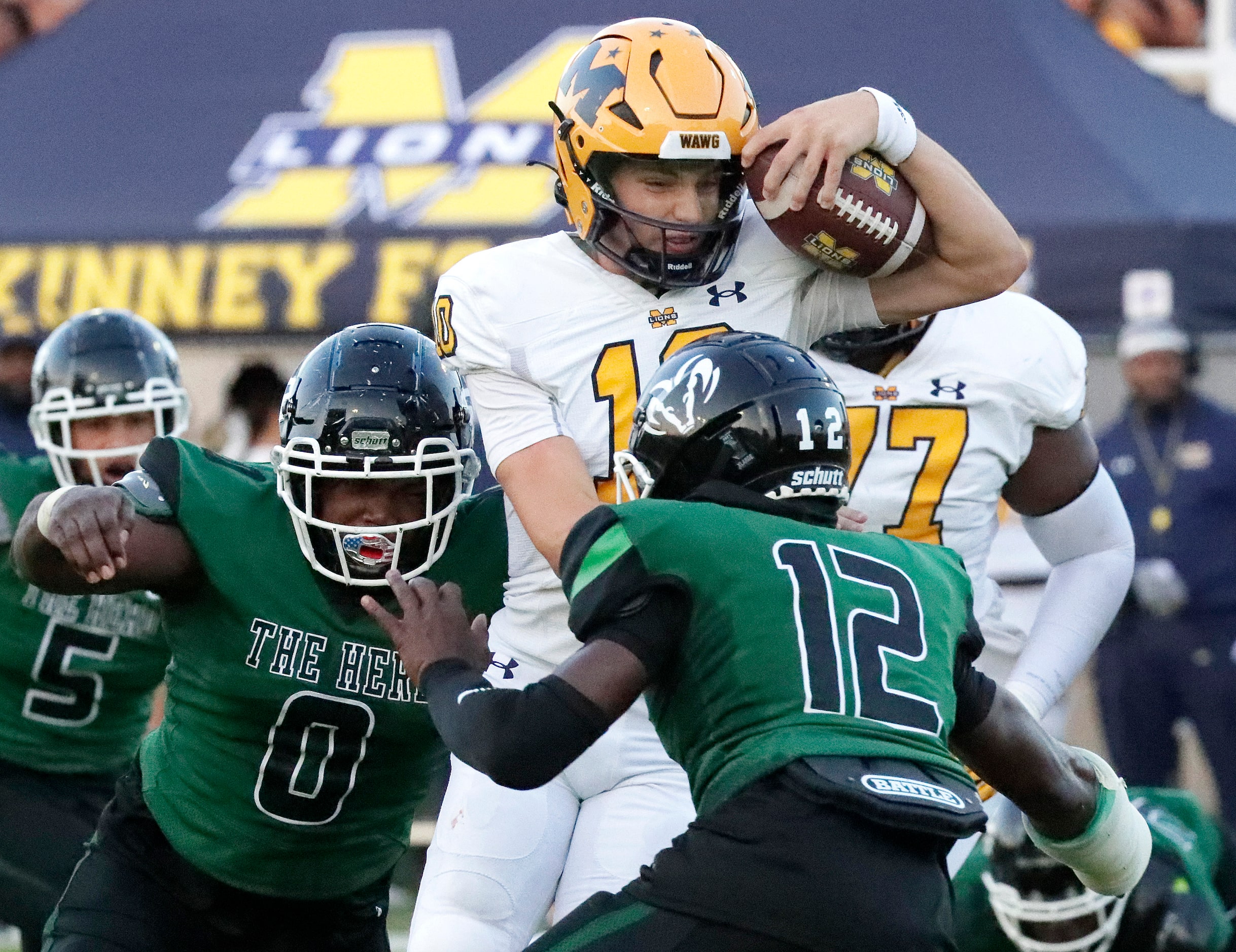 Berkner High School defensive lineman Jaquavious Kennedy (0) and Berkner High School...