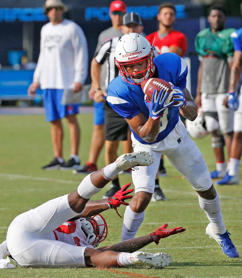 Mustangs defensive back Rodney Clemons (8) intercepts a tipped pass intended for Myron...