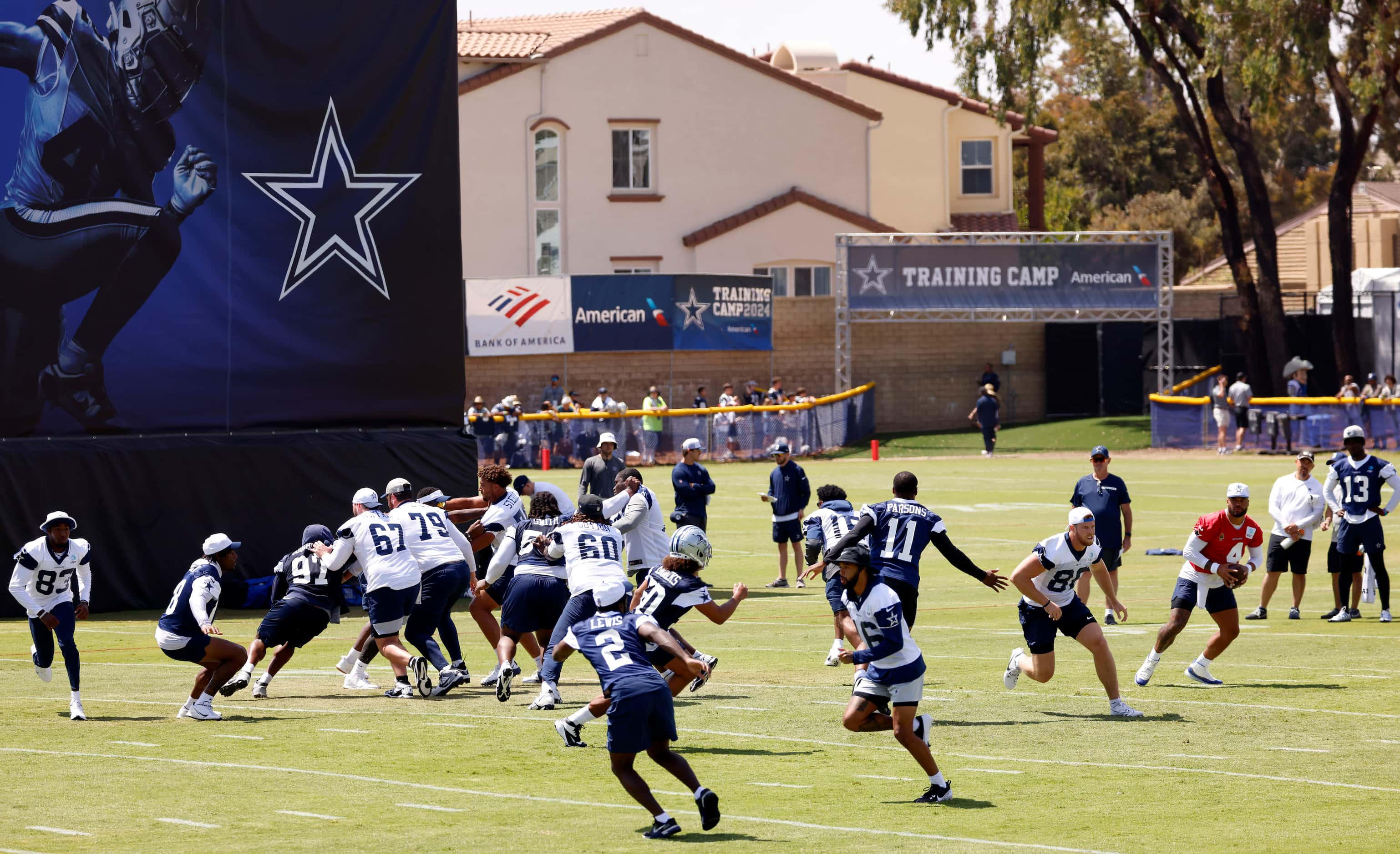 Dallas Cowboys quarterback Dak Prescott (4) rolls out during a mock game during the team’s...