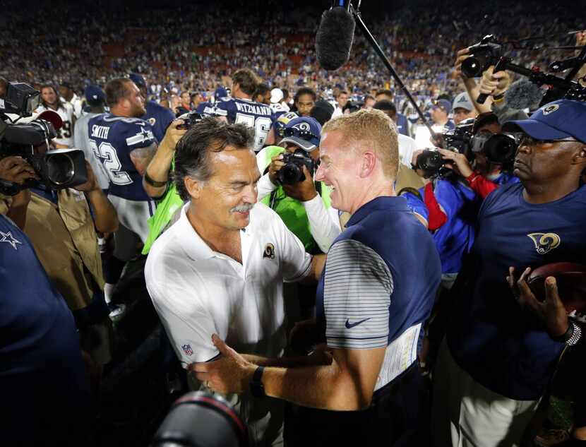 Dallas Cowboys head coach Jason Garrett (right) and Los Angeles Rams head coach Jeff Fisher...