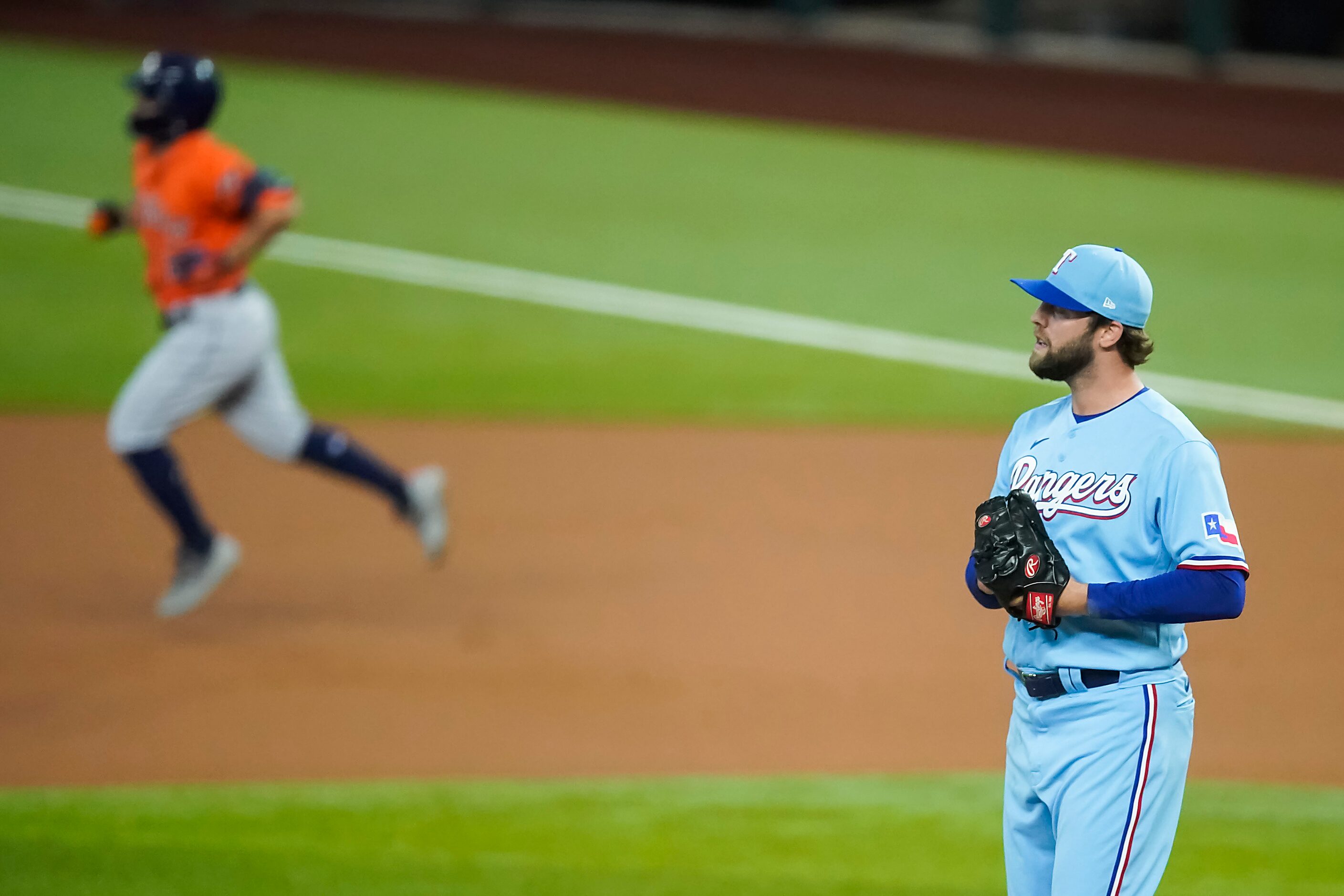 Texas Rangers pitcher Jordan Lyles reacts as Houston Astros second baseman Jose Altuve...