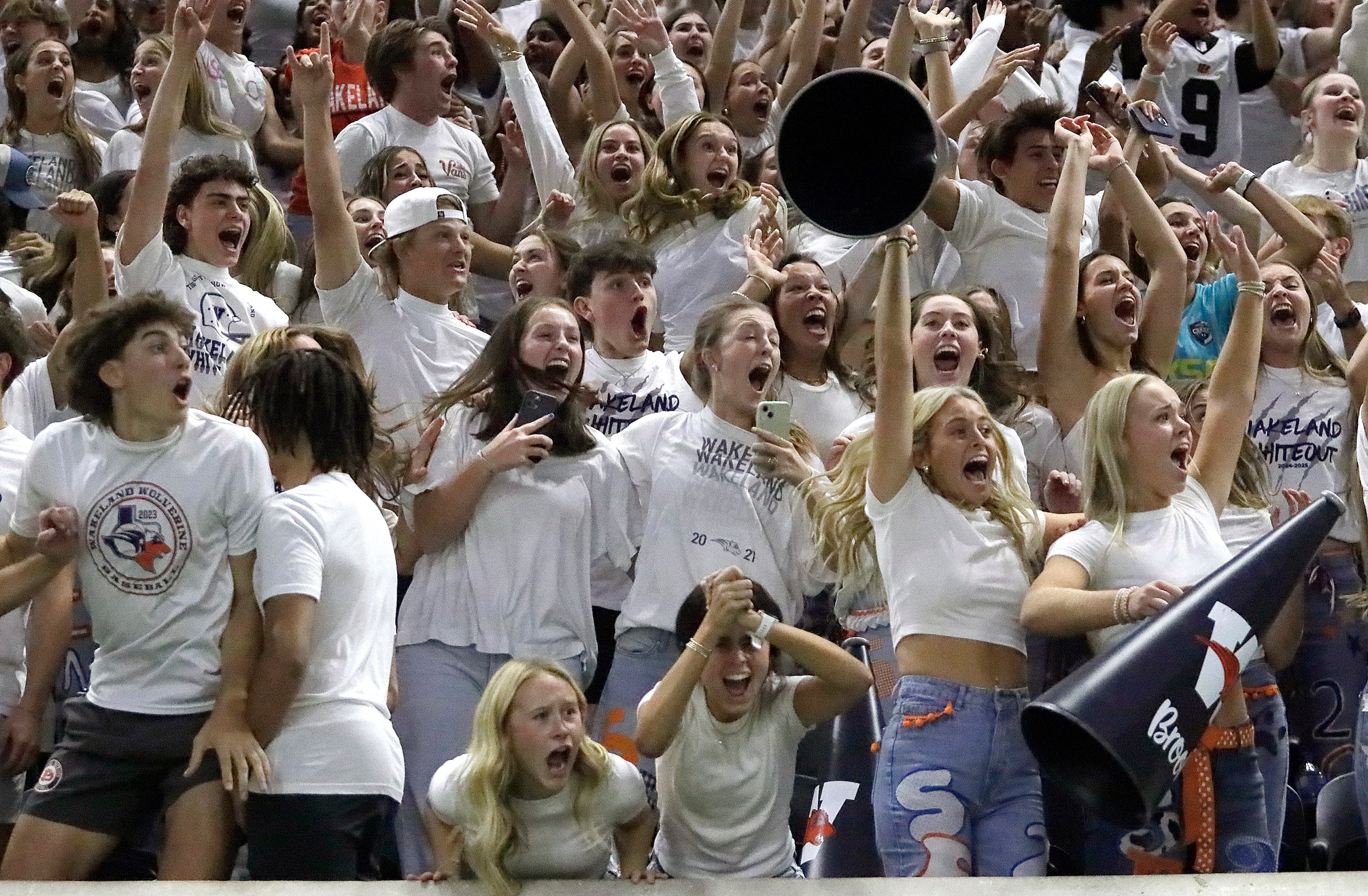 The Wakeland High School student section reacts to a 43 yard field goal with no time left to...