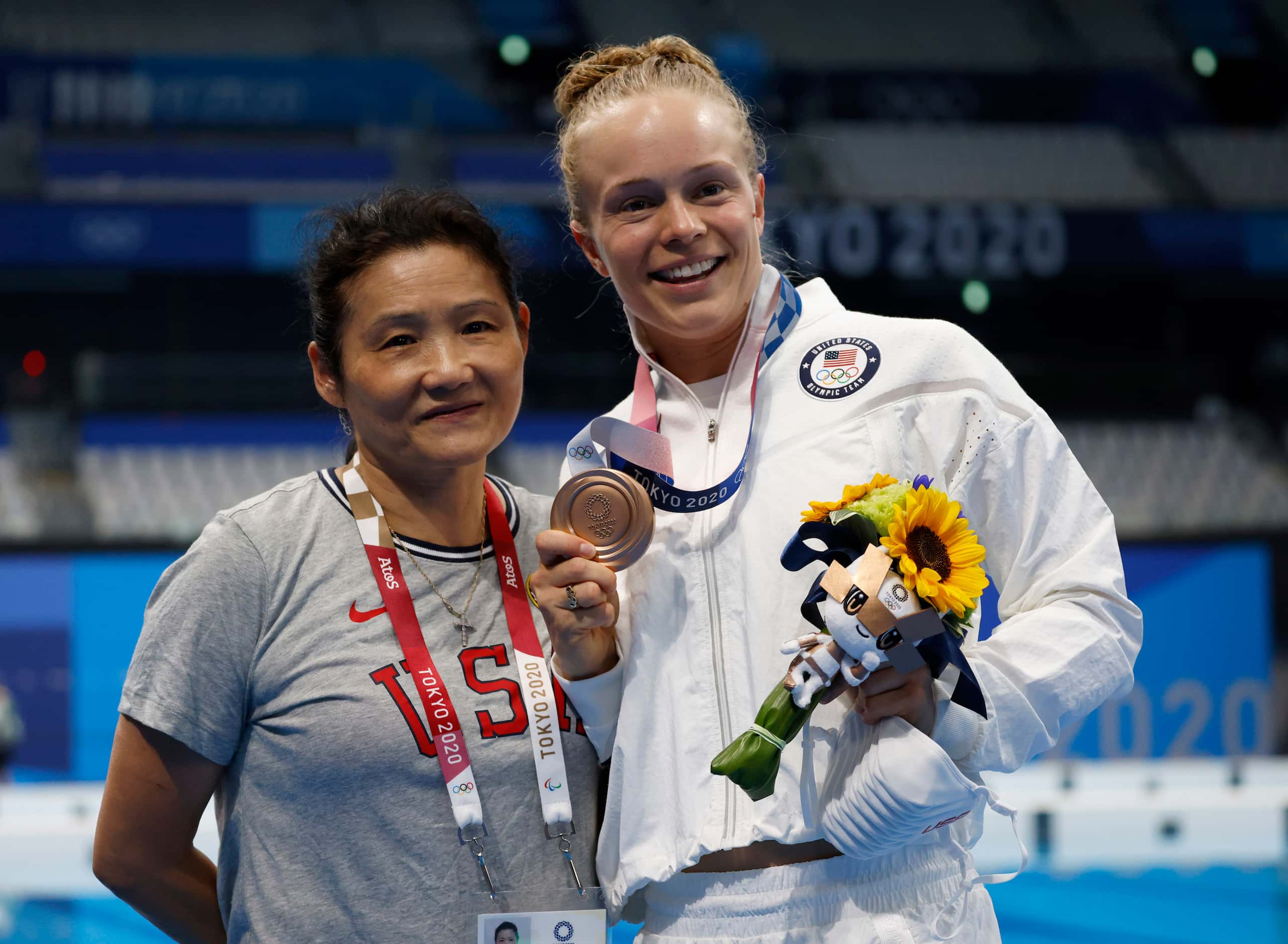 USA’s diving coach Jianli You and Krysta Palmer pose for photographers after competing in...