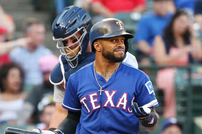 Texas Rangers left fielder Delino DeShields (3) reacts after being called out on strikes...