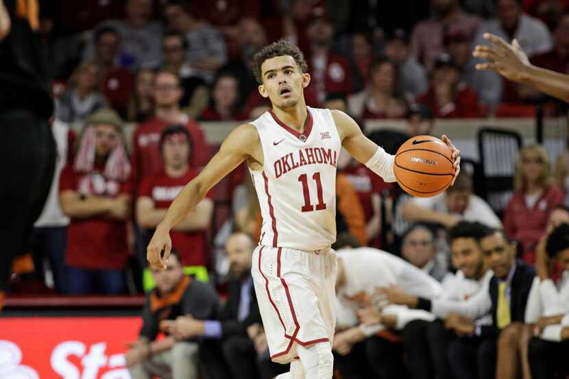 NORMAN, OK - FEBRUARY 17: Trae Young #11 of the Oklahoma Sooners looks at the court after...