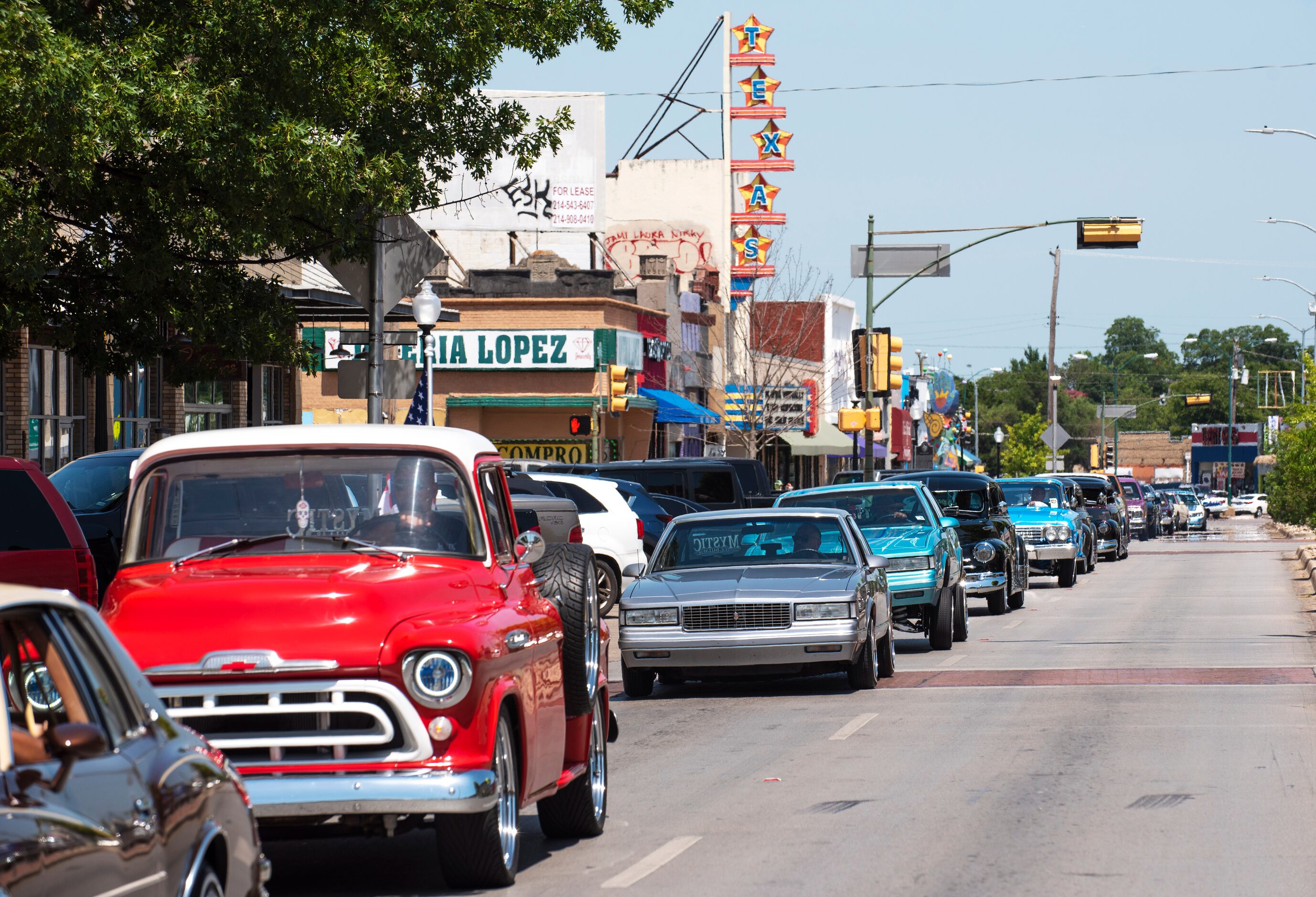 Lowriders from the United Lowriders Association cruise along Jefferson Boulevard as they...