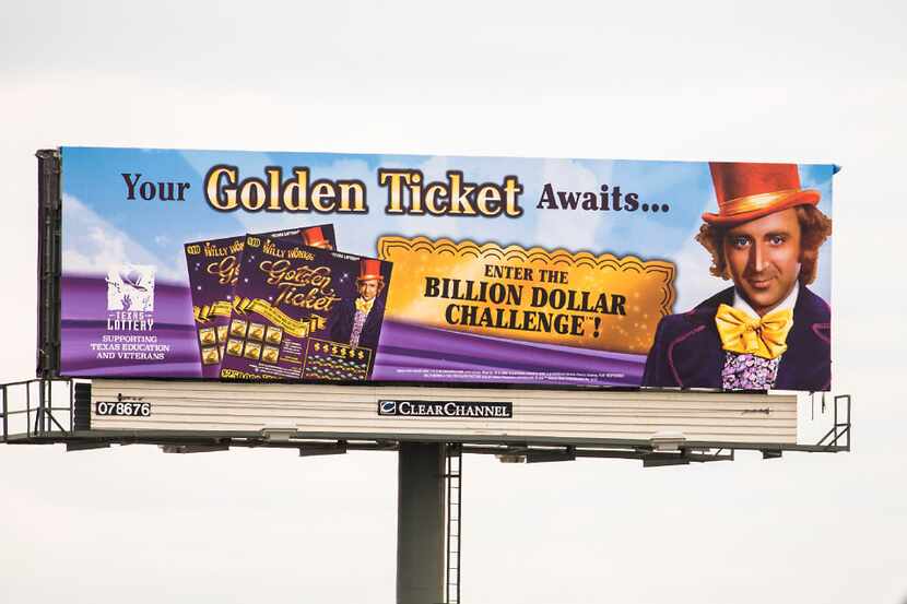 A billboard for the Texas Lottery's new Willy Wonka Golden Ticket game rises over Texas...
