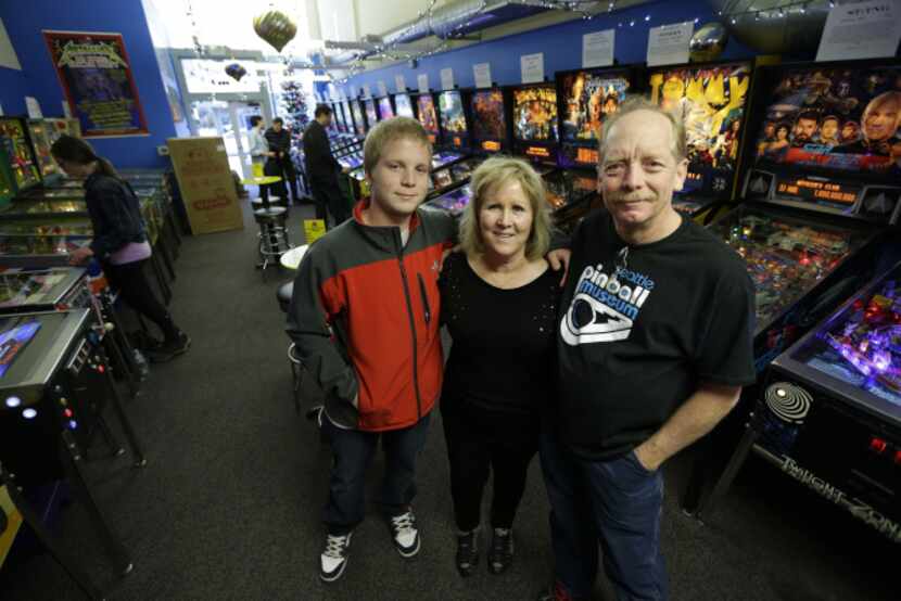 In this Dec. 16, 2013 photo, Charles Martin, right, poses for a photo with his wife Cindy,...