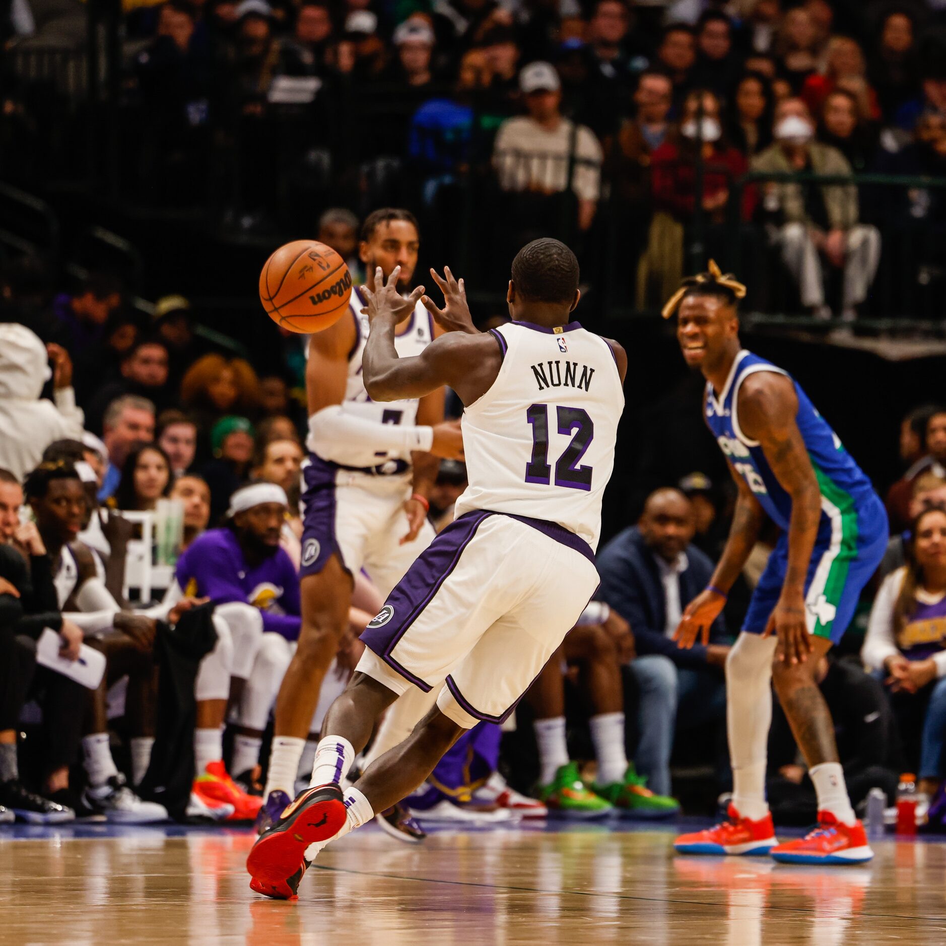 Los Angeles Lakers guard Kendrick Nunn (12) receives a pass from Los Angeles Lakers forward...