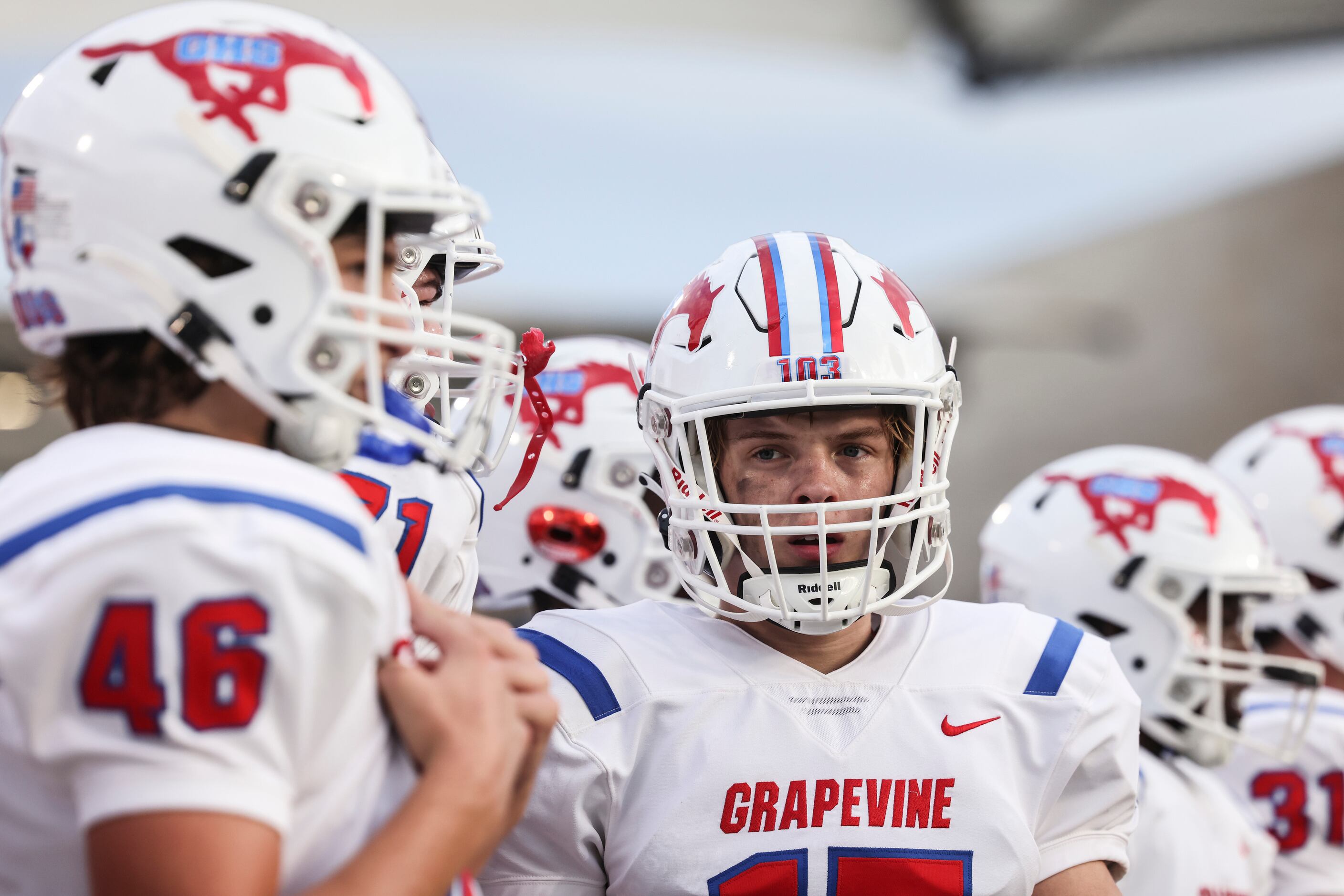 Grapevine High School’s Mason Tatum walks along the sidelines during the football game...