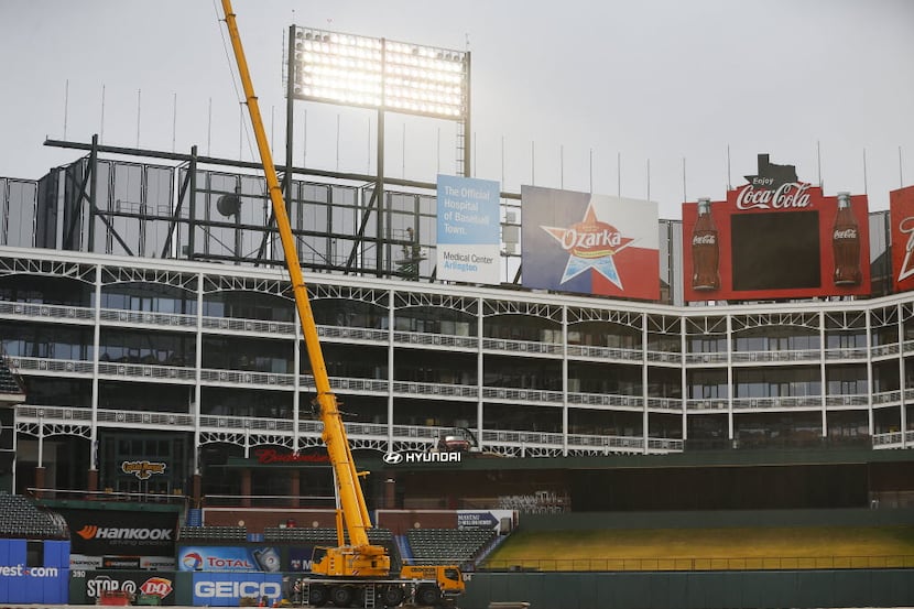 Construction of a new left field video board is taking place at Globe Life Park in...