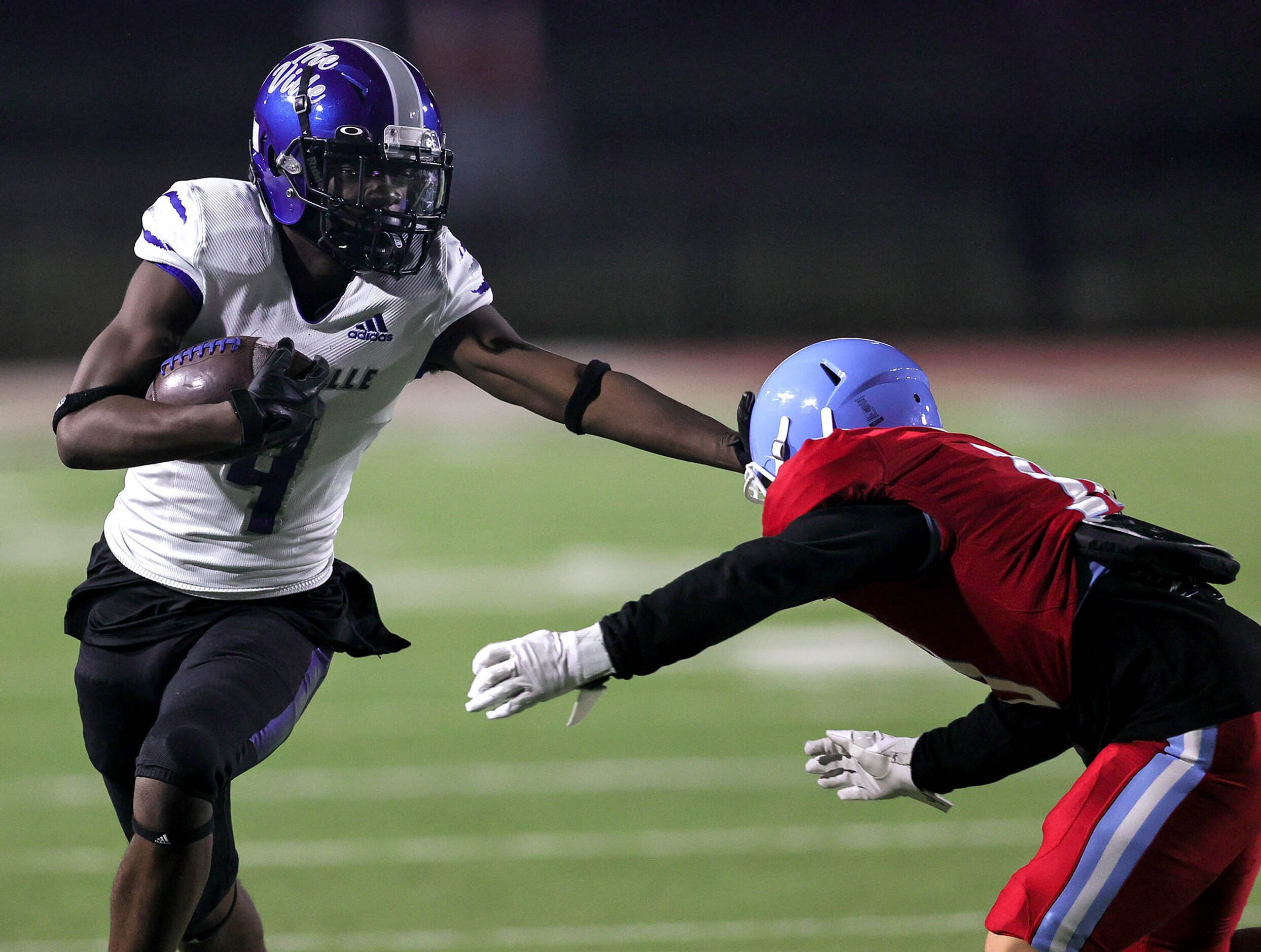 Seagoville wide receiver Damarion Watson (left) tries to get past Thomas Jefferson defensive...