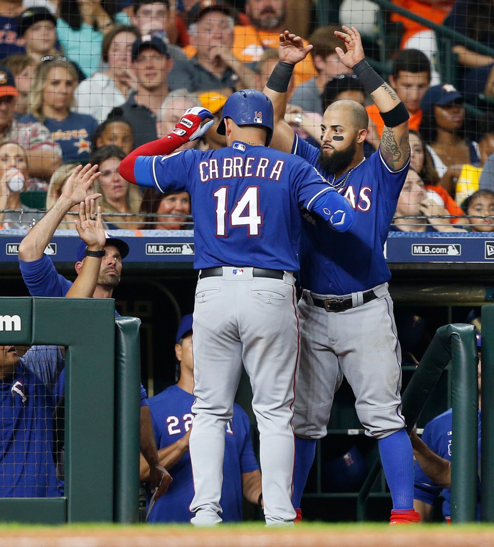 HOUSTON, TEXAS - JULY 19: Asdrubal Cabrera #14 of the Texas Rangers receives congratulations...