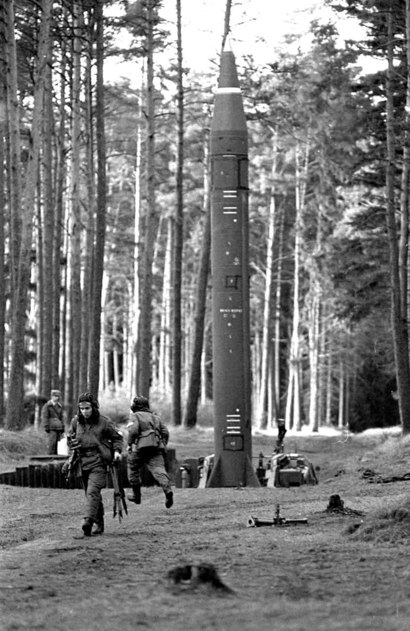 Soldiers of the East German army at a launching platform with a rocket during a military...