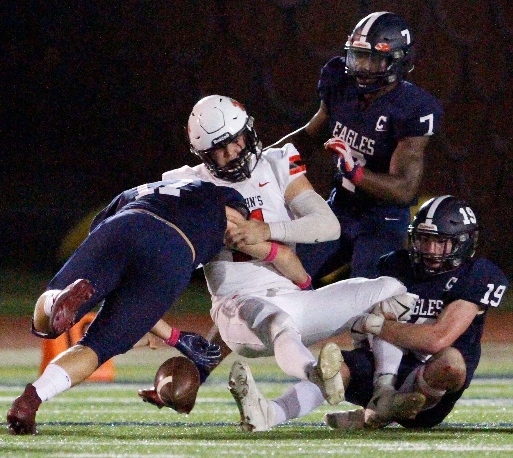 Episcopal School of Dallas senior defenders Jake Lewis (17), left, Chase Kennedy (7) and...