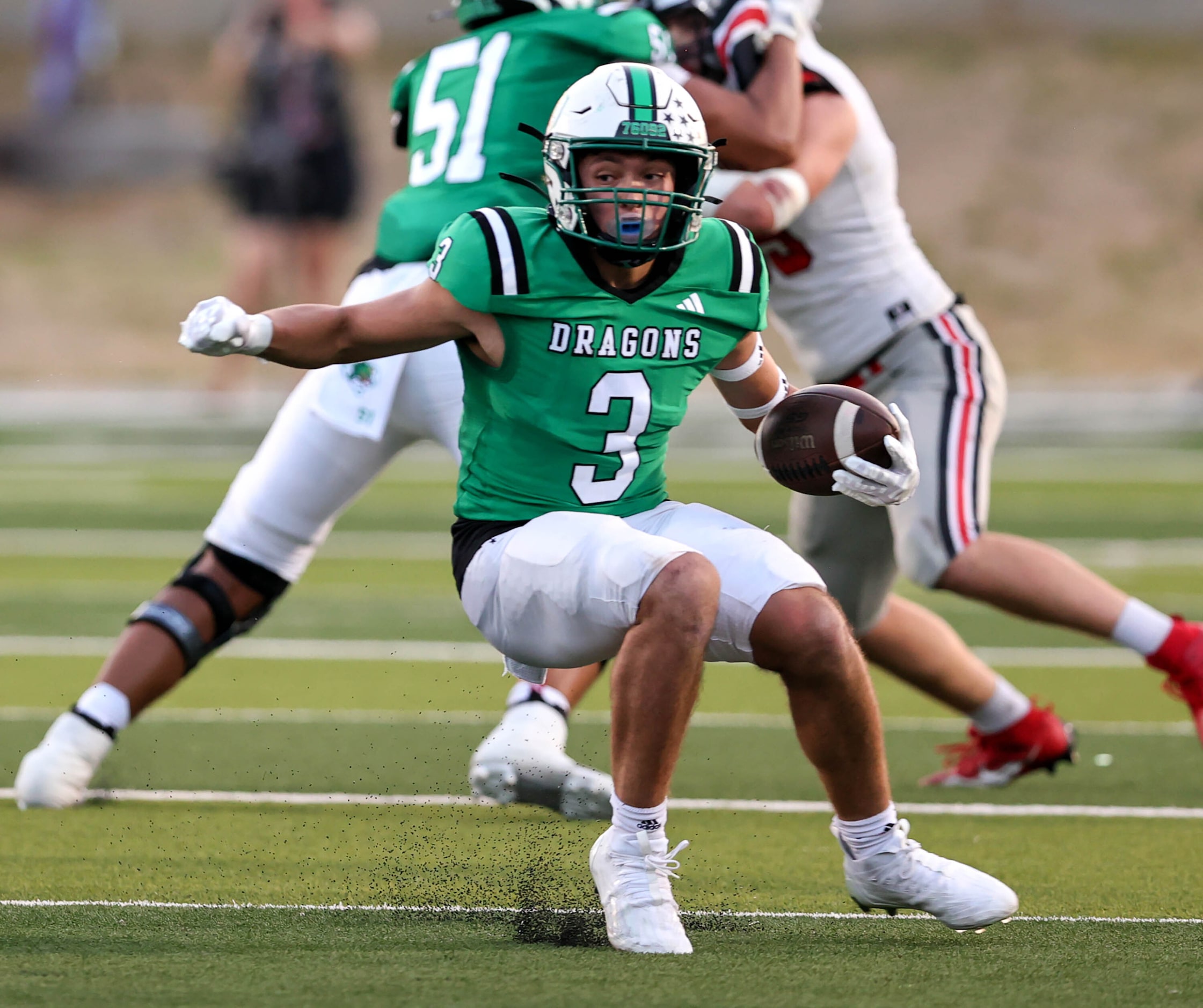 Southlake Carroll running back Davis Penn looks for running room against Flower Mound Marcus...