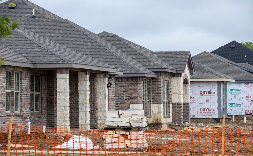 Construction was underway last month on houses in Kensington Valley by Camden Homes in...