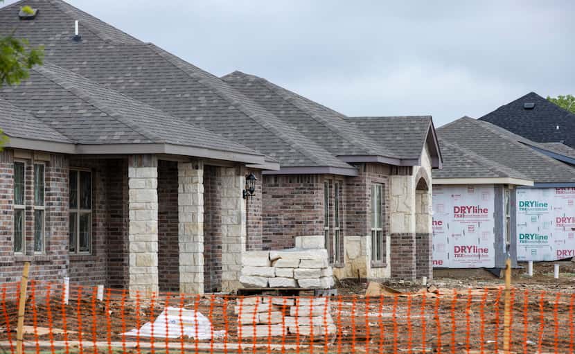 Construction was underway last month on houses in Kensington Valley by Camden Homes in...