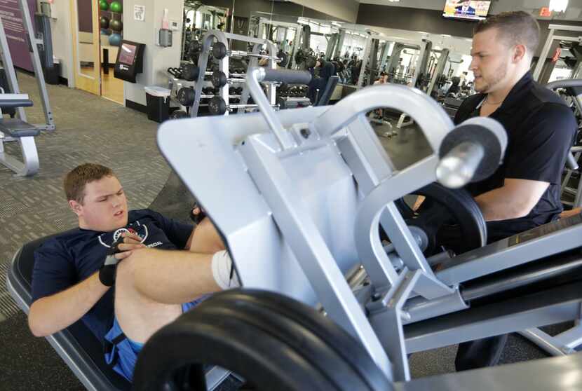 Robert Hise, 17, ( left) and Daniel Stein with Special Strong exercise at Anytime Fitness in...