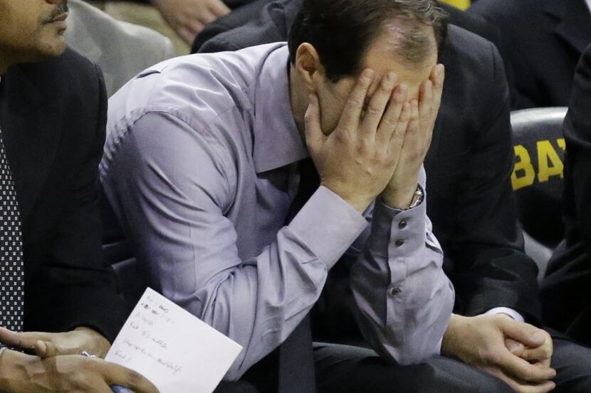 Baylor head coach Scott Drew reacts on the bench in the final minute of an NCAA college...
