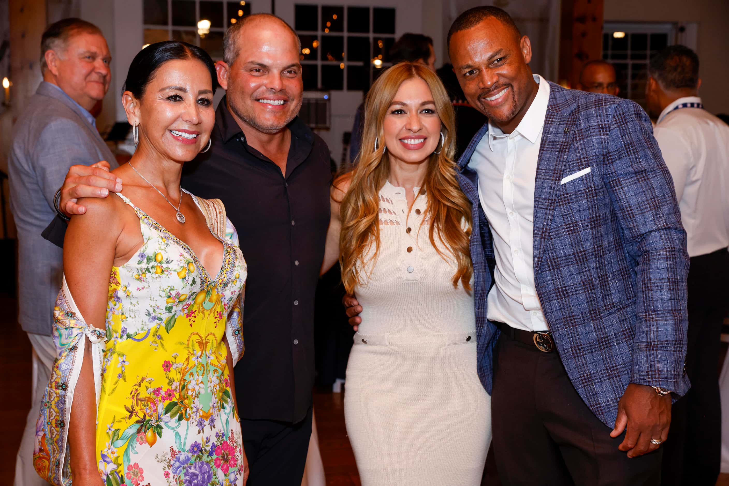 Patry Rodriguez stands with her husband and Hall of Famer Ivan 'Pudge' Rodriguez as they...